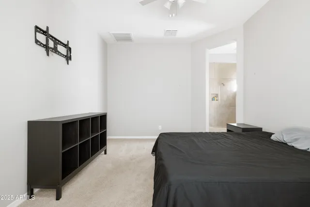 a bedroom with a bed and a cabinets