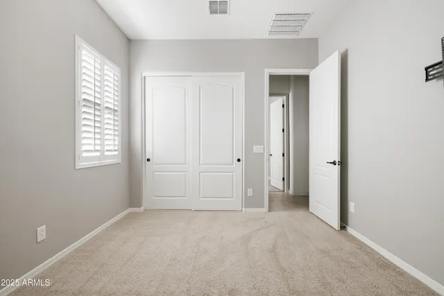 a view of empty room with windows