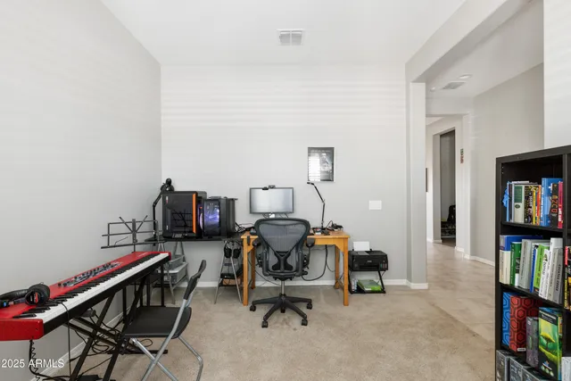 a view of a workspace with furniture