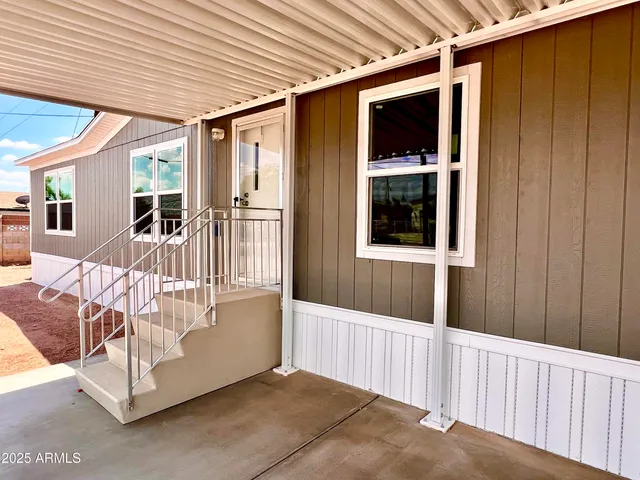 a view of a porch with furniture