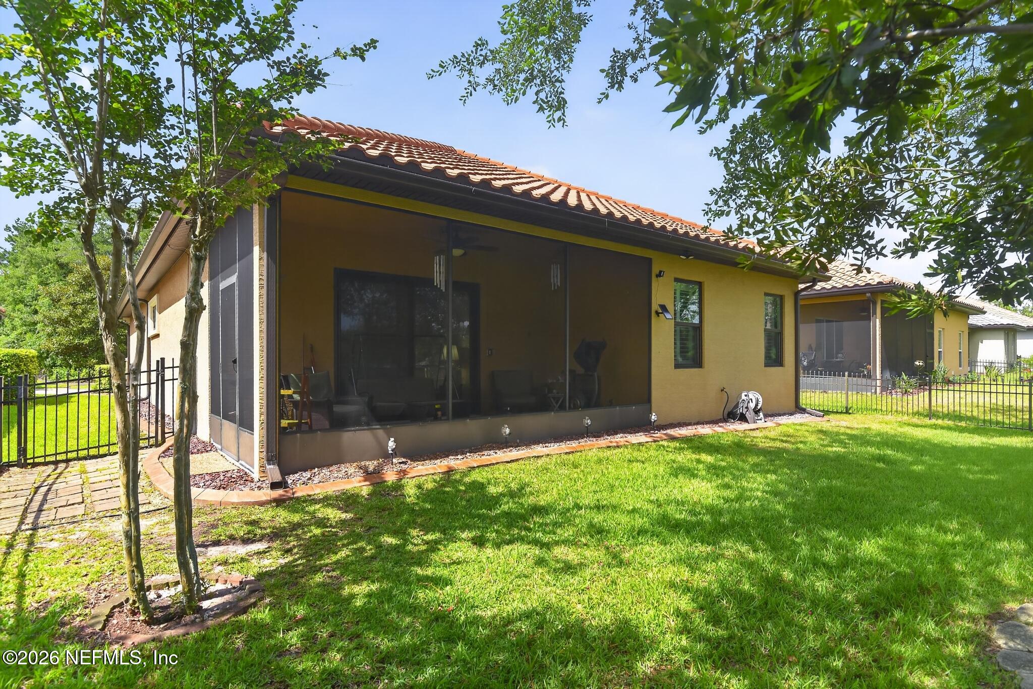110 Vía Roma Ormond Beach, FL 32174 - Photo 38 of 43 front view of a house with a yard