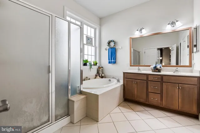 a bathroom with a sink mirror and toilet