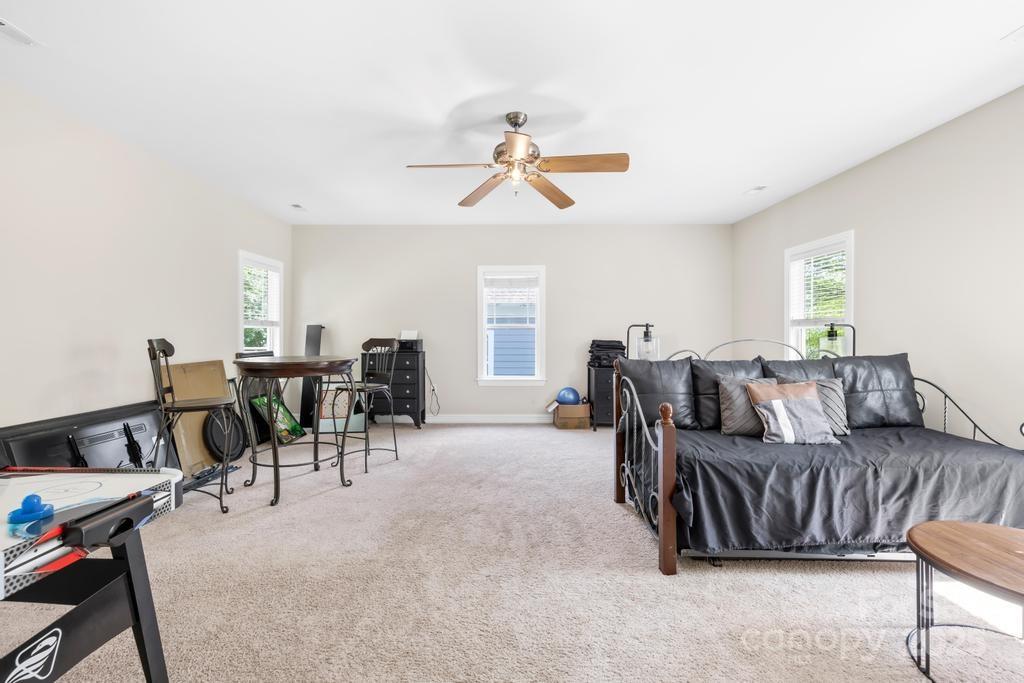 18810 Coachmans Trace Cornelius, NC 28031 - Photo 25 of 30 a living room with furniture a dining table and chairs with wooden floor