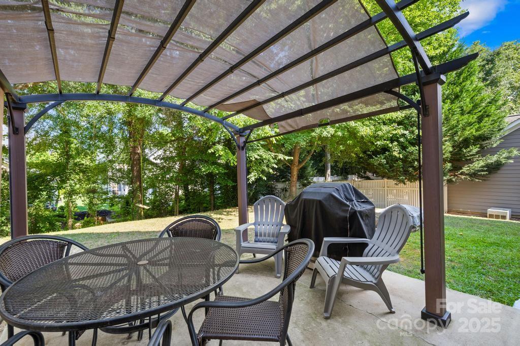 18810 Coachmans Trace Cornelius, NC 28031 - Photo 27 of 30 a view of backyard with seating space