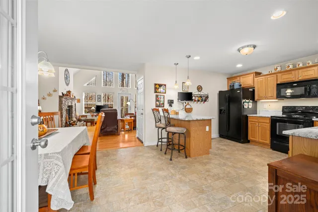 a living room with furniture a flat screen tv and a table