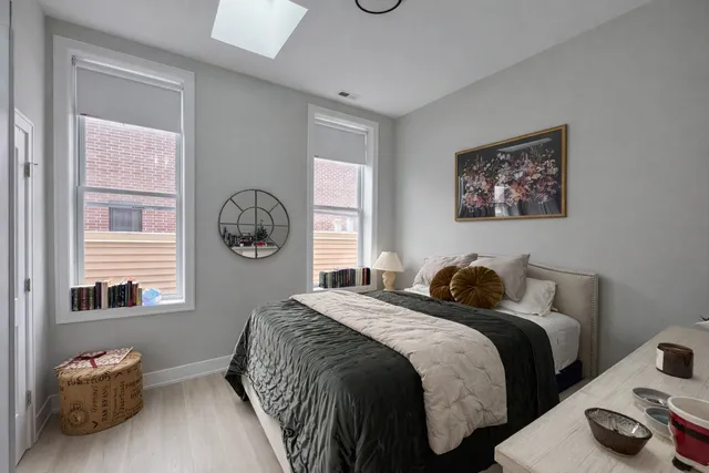 a bedroom with bed and a window