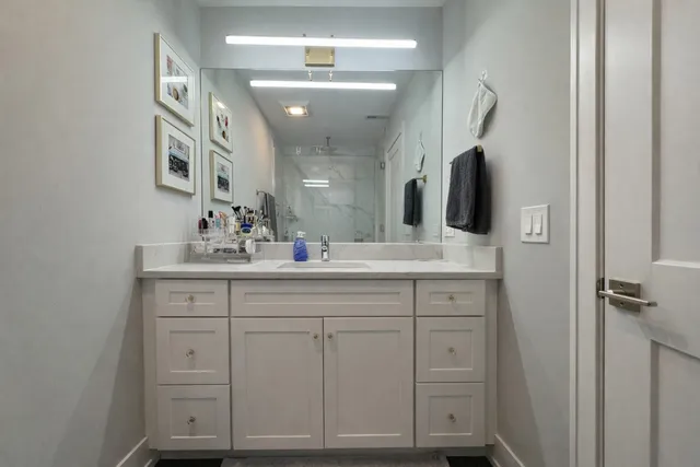 a bathroom with a double vanity sink and mirror