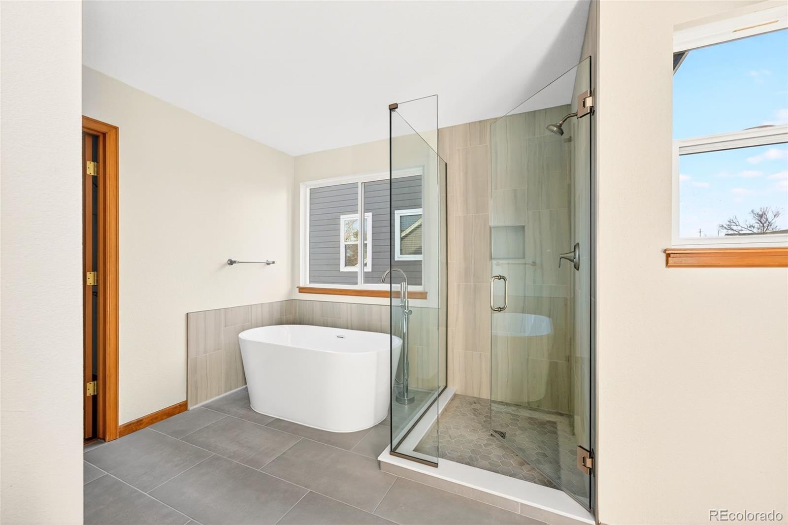 8852 Chestnut Hill Lane Highlands Ranch, CO 80130 - Photo 21 of 38 a bathroom with a shower and a sink