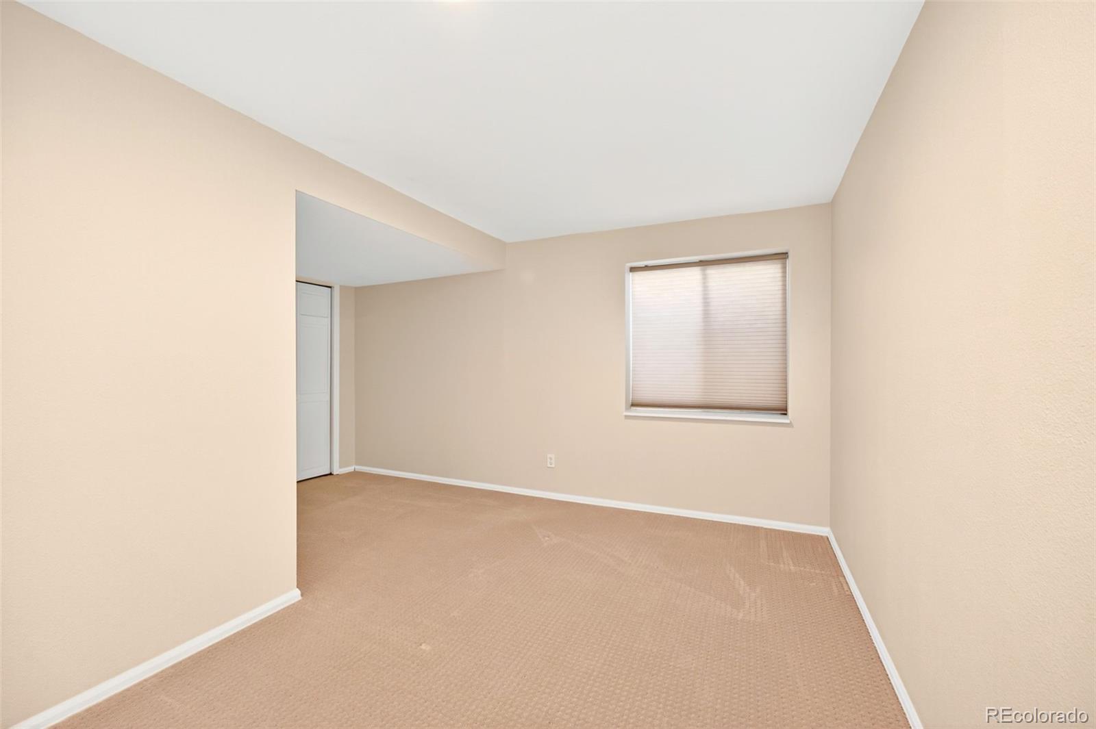 8852 Chestnut Hill Lane Highlands Ranch, CO 80130 - Photo 28 of 38 a view of an empty room with a window