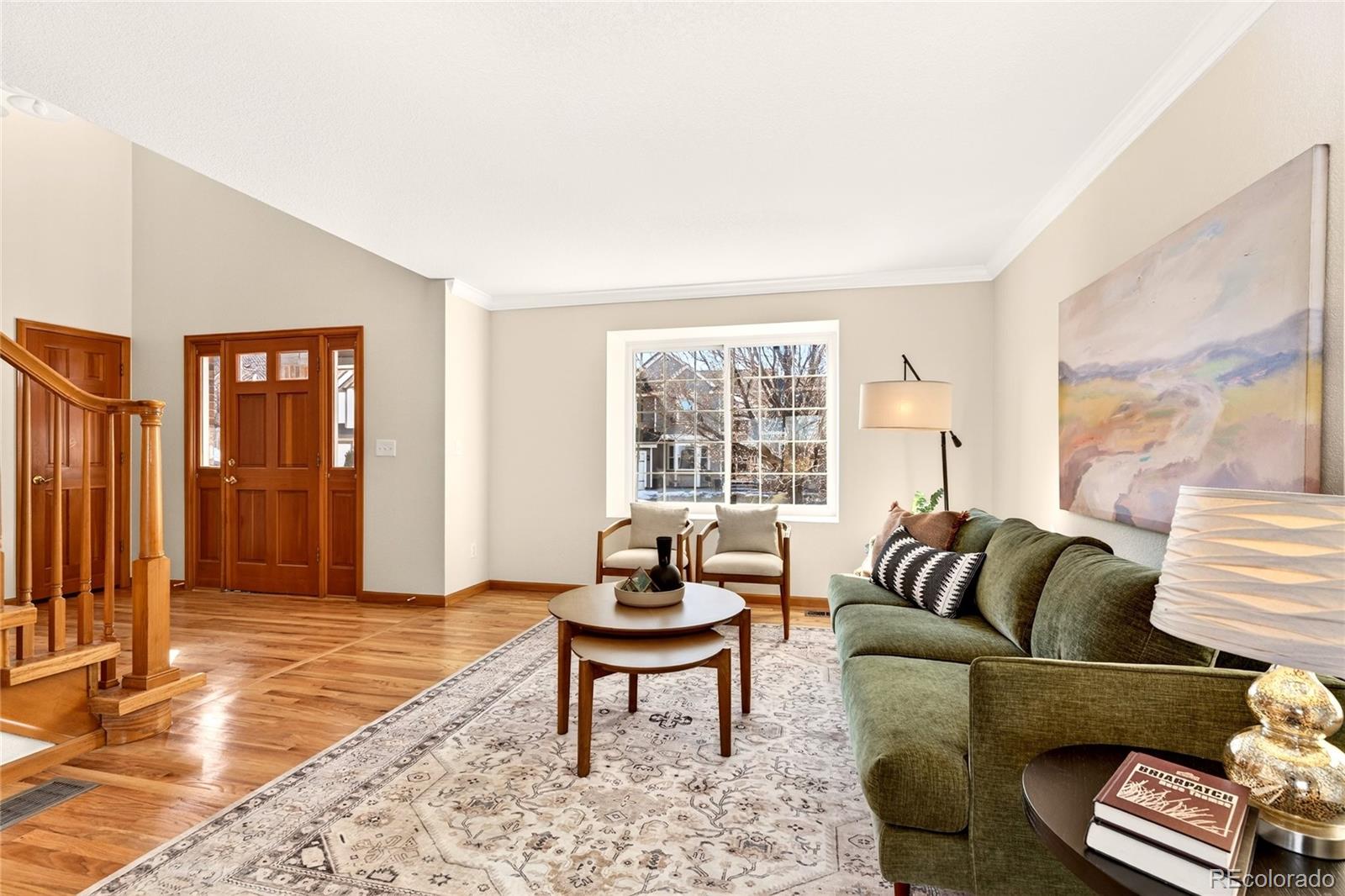 8852 Chestnut Hill Lane Highlands Ranch, CO 80130 - Photo 3 of 38 a living room with furniture and a window