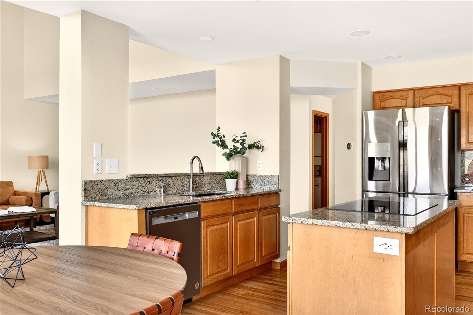 8852 Chestnut Hill Lane Highlands Ranch, CO 80130 - Photo 9 of 38 a spacious bathroom with a granite countertop sink and a mirror