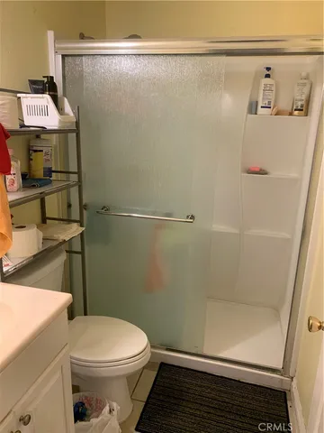 a kitchen with a sink a stove and cabinets