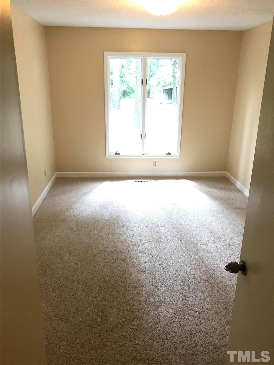 10021 Ray Road Raleigh, NC 27613 - Photo 8 of 19 an empty room with a window