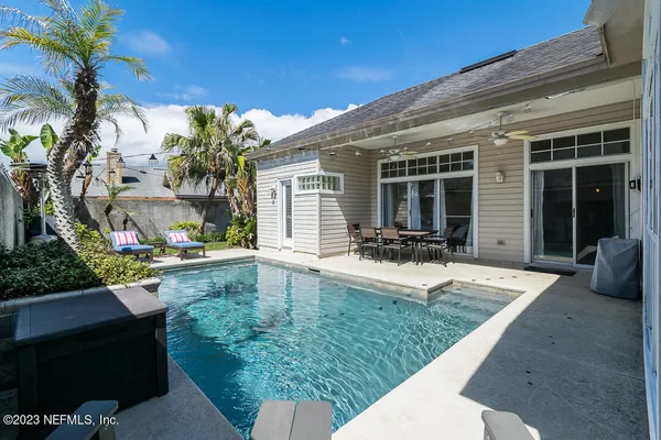 a front view of house with yard and outdoor seating