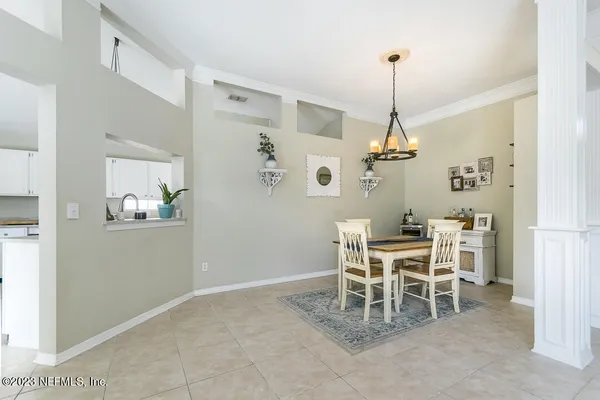 a dining room with a table and chairs