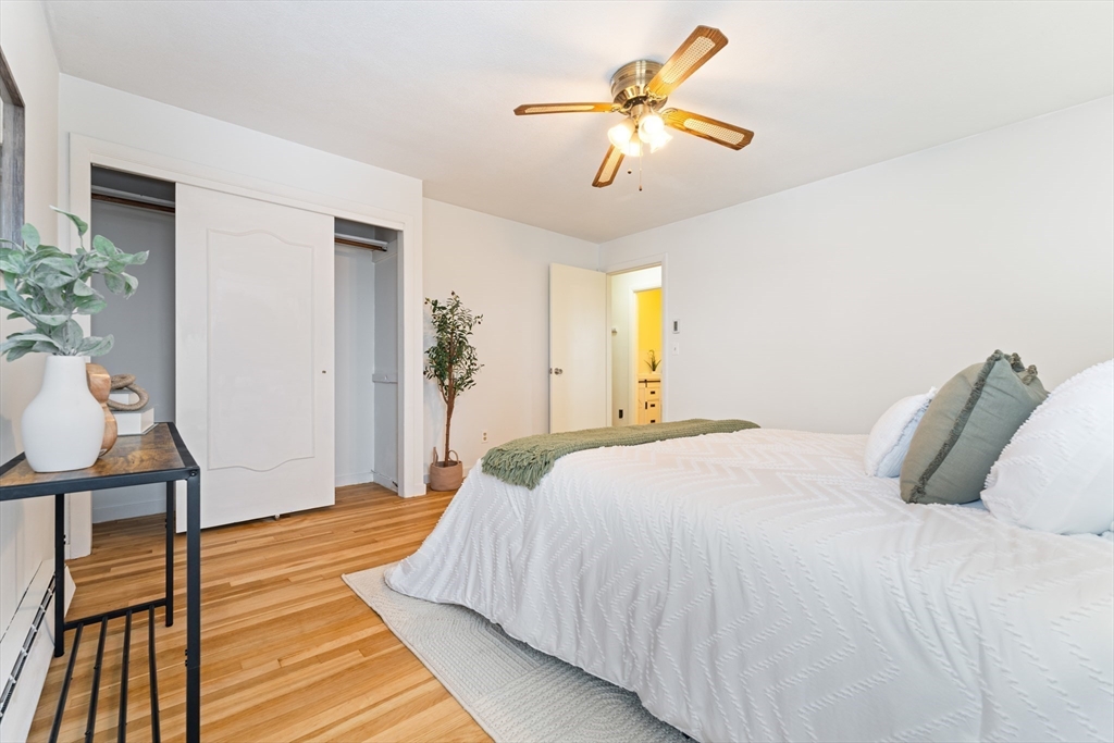 35 Dustin Street Worcester, MA 01604 - Photo 19 of 32 a bedroom with a bed and a chandelier