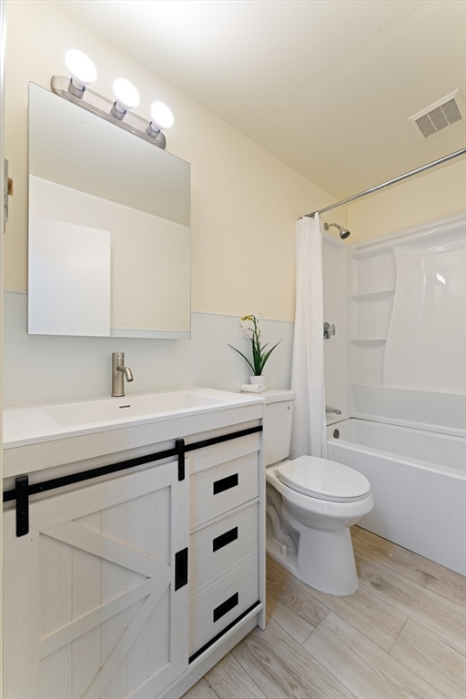 35 Dustin Street Worcester, MA 01604 - Photo 21 of 32 a bathroom with a double vanity sink toilet and shower