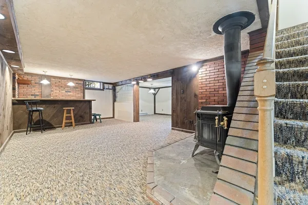 a view of hall way with furniture and staircase