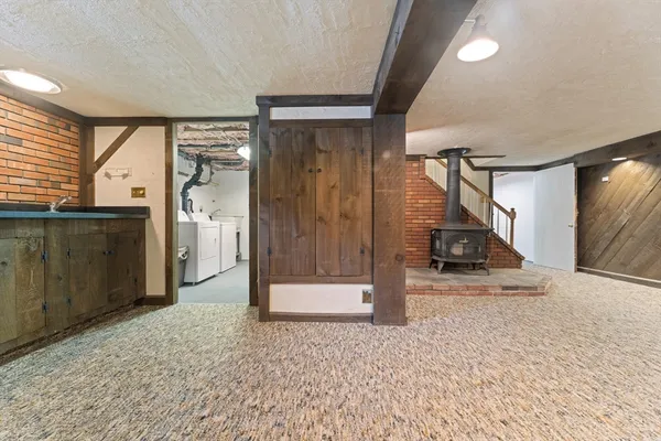 a view of a hallway with a living room