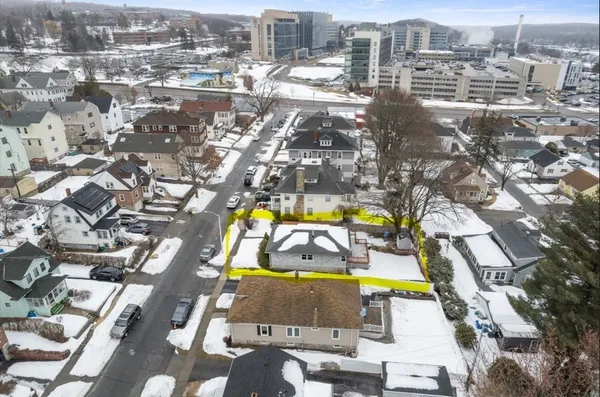 an aerial view of residential houses with swimming pool
