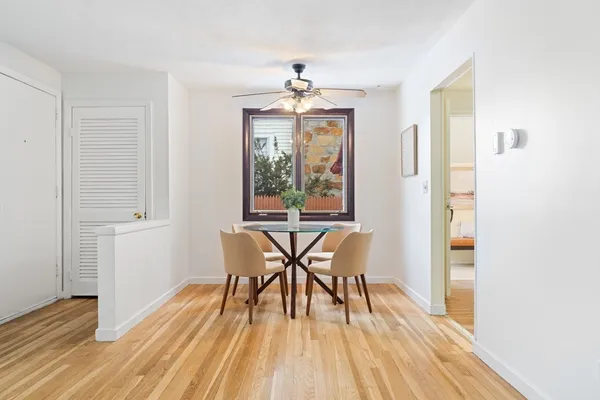 a view of a dining room with furniture window and wooden floor