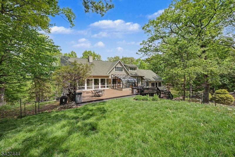 156 Kingsland Road Boonton, NJ 07005 - Photo 4 of 38 a view of a house with a big yard and large trees