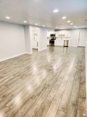 36 West Syracuse Road Vineyard, UT 84059 - Photo 50 of 56 Expansive living area featuring wood-finish flooring and recessed lighting