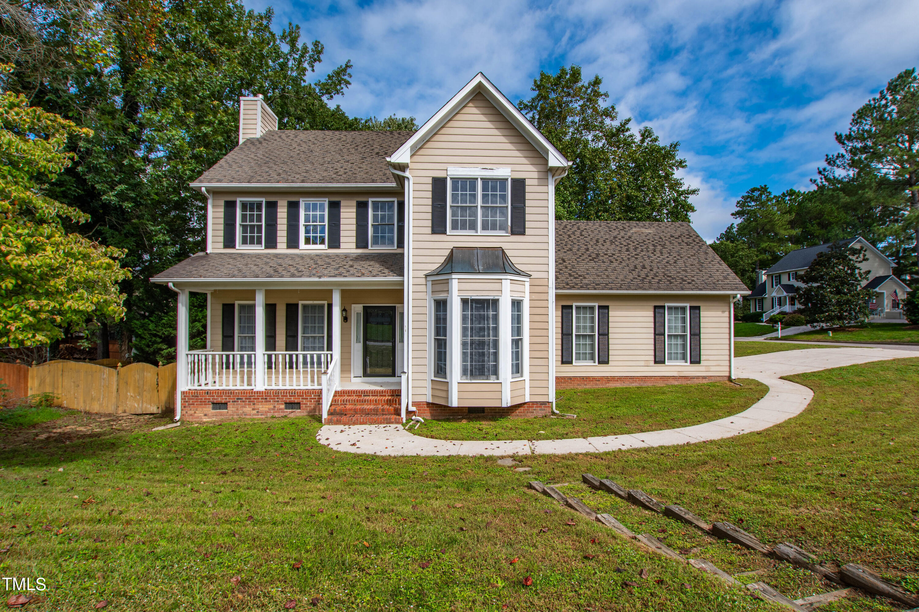 4305 Riverport Road Raleigh, NC 27616 - Photo 1 of 43 a front view of a house with a yard and trees