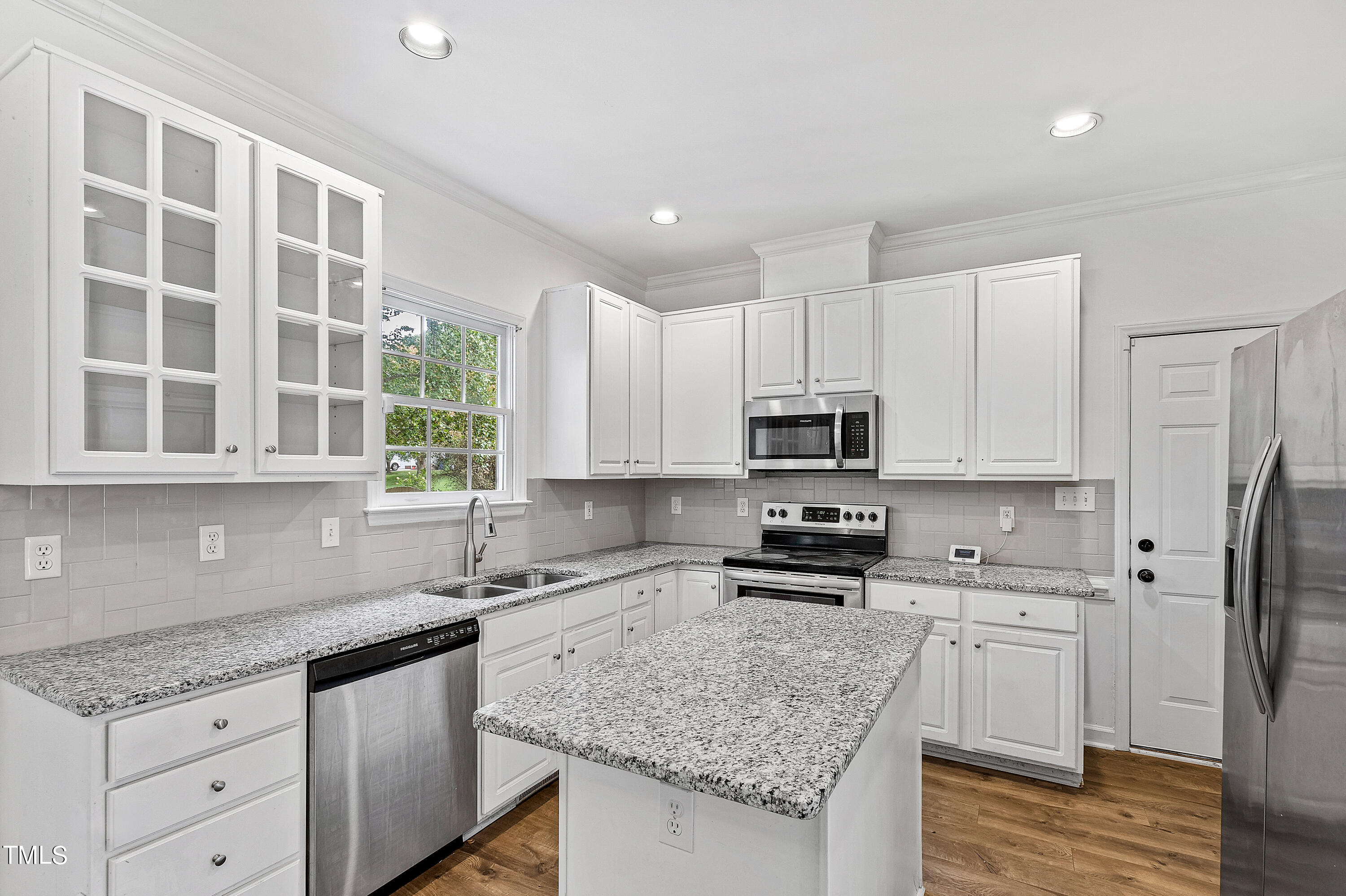 4305 Riverport Road Raleigh, NC 27616 - Photo 13 of 43 a kitchen with stainless steel appliances granite countertop a sink stove and refrigerator