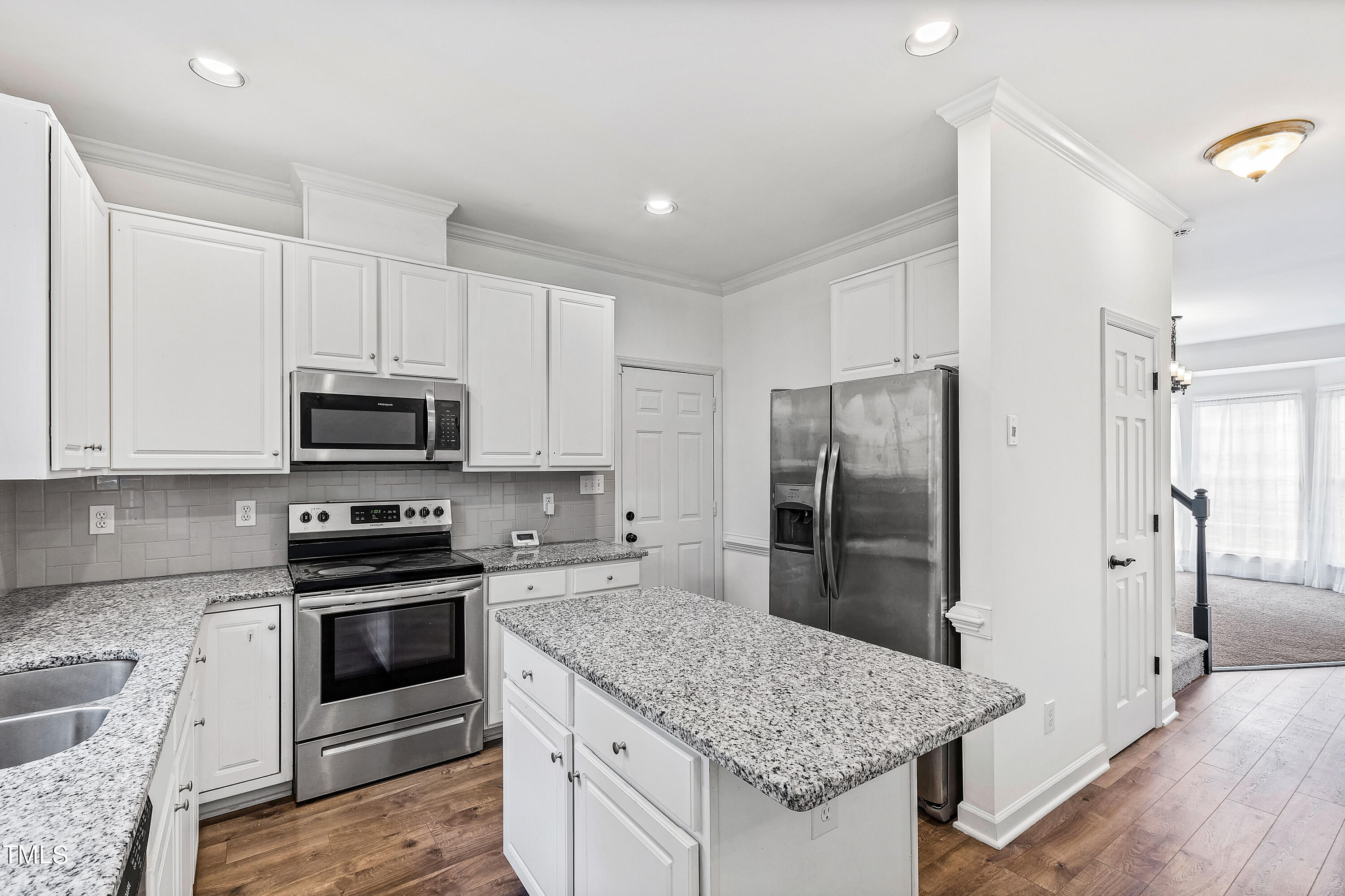 4305 Riverport Road Raleigh, NC 27616 - Photo 14 of 43 a kitchen with stainless steel appliances granite countertop a sink stove and refrigerator
