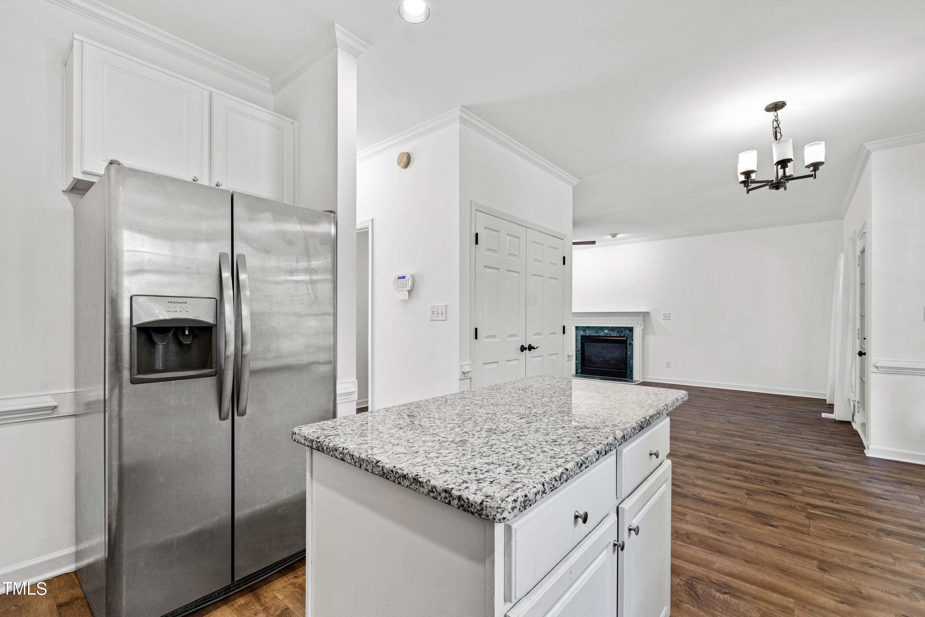 4305 Riverport Road Raleigh, NC 27616 - Photo 17 of 43 a kitchen with kitchen island a counter top space and refrigerator