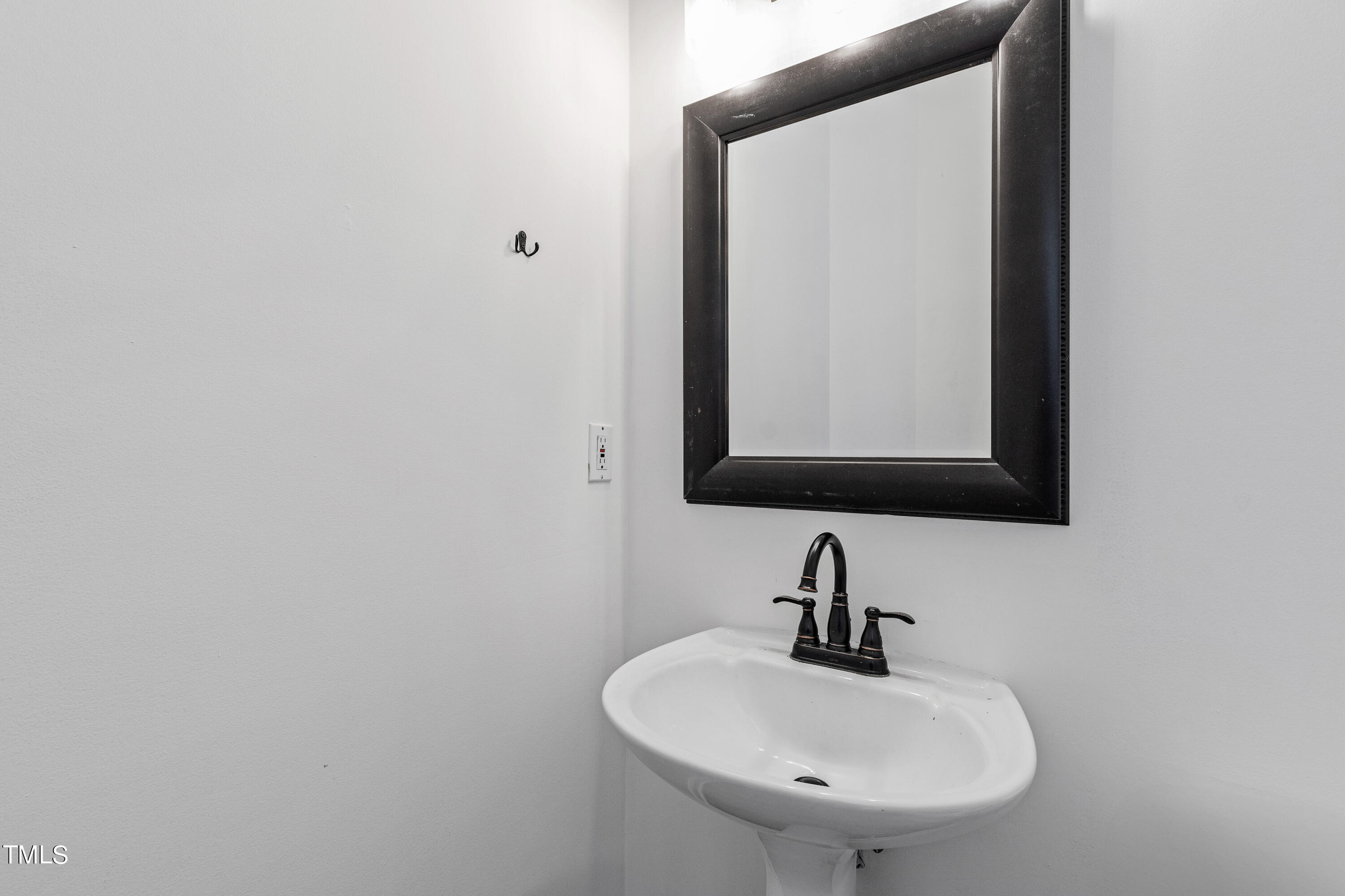 4305 Riverport Road Raleigh, NC 27616 - Photo 18 of 43 a bathroom with a sink and a mirror