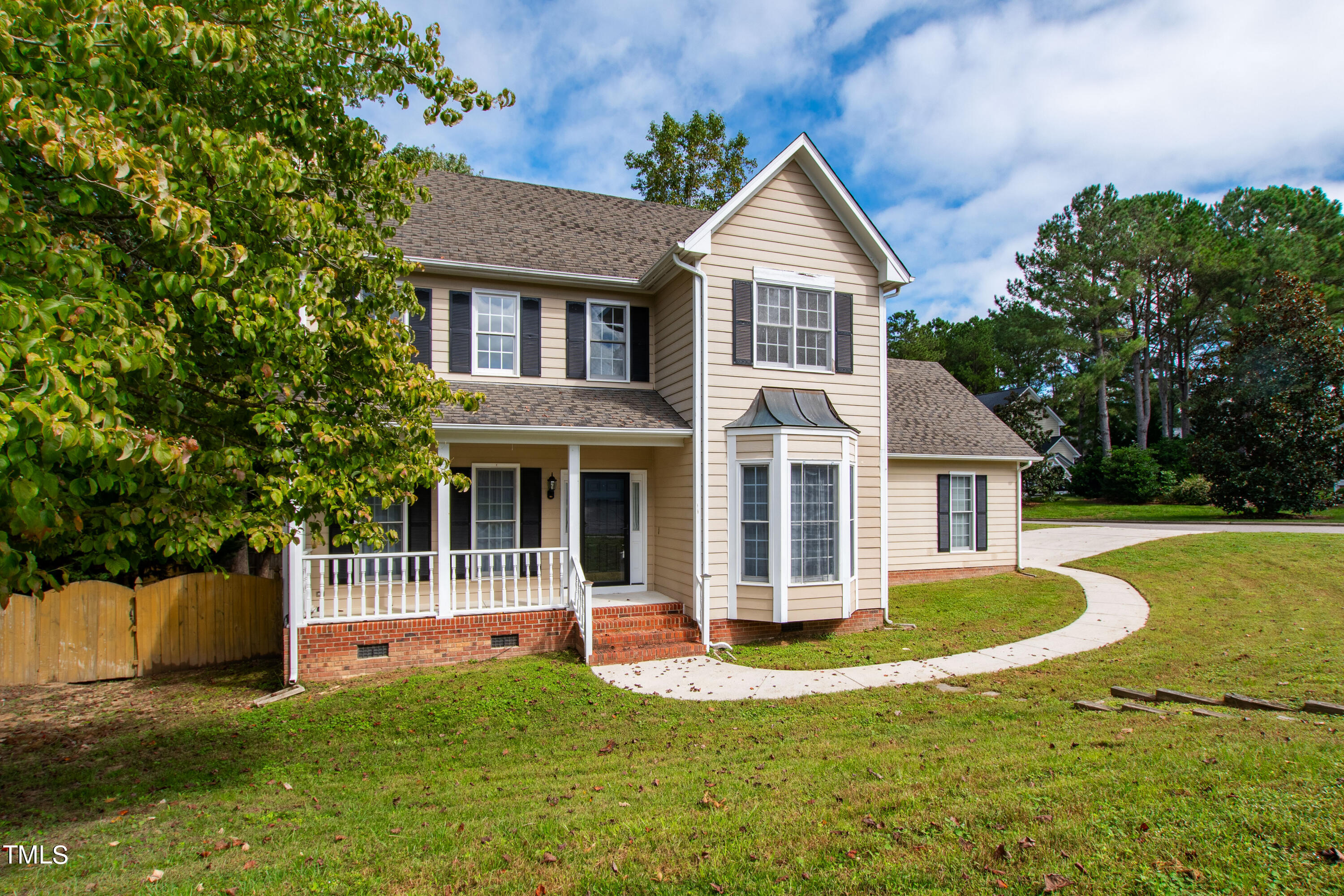4305 Riverport Road Raleigh, NC 27616 - Photo 40 of 43 a front view of a house with a yard and garage