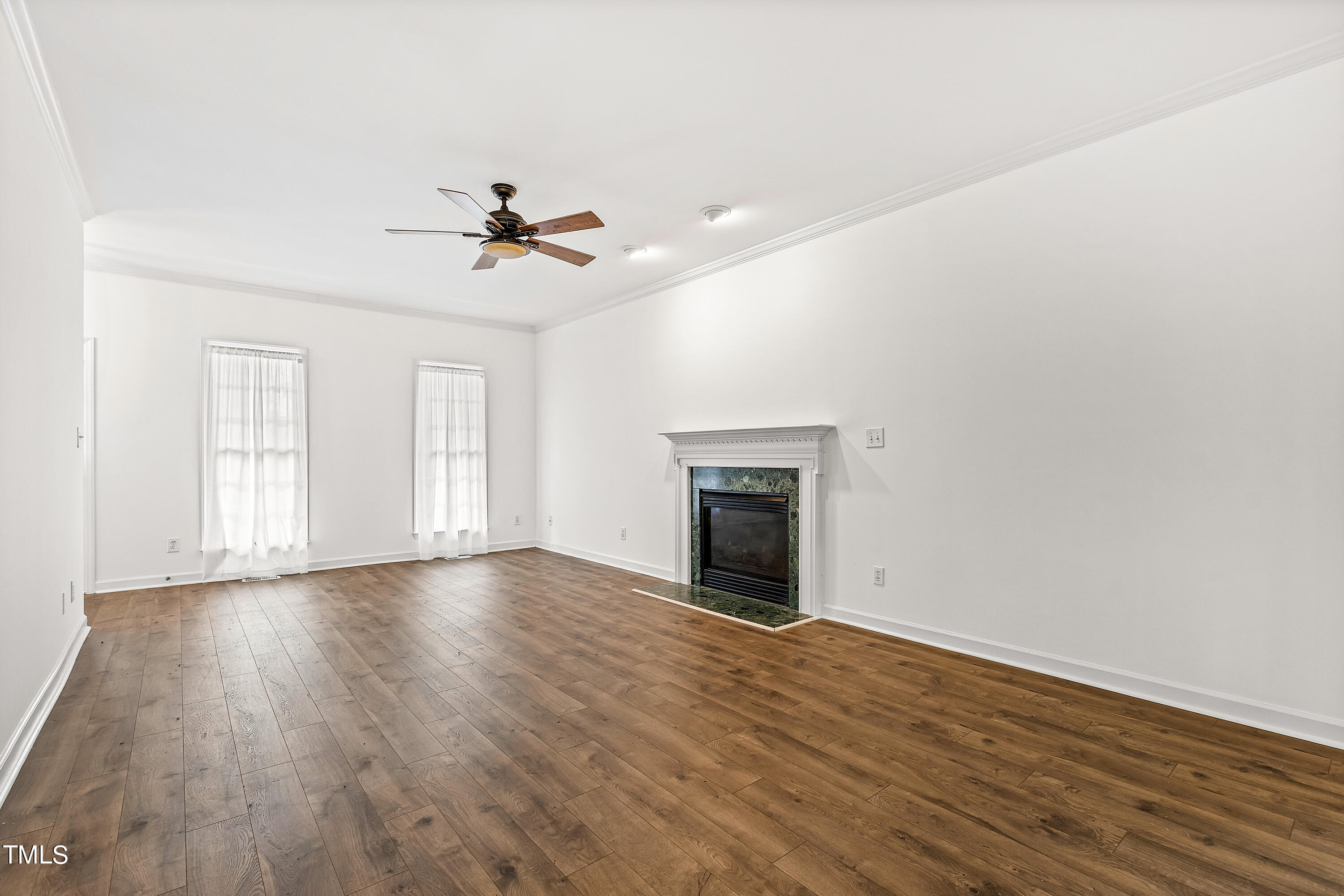 4305 Riverport Road Raleigh, NC 27616 - Photo 8 of 43 wooden floor in an empty room with a window