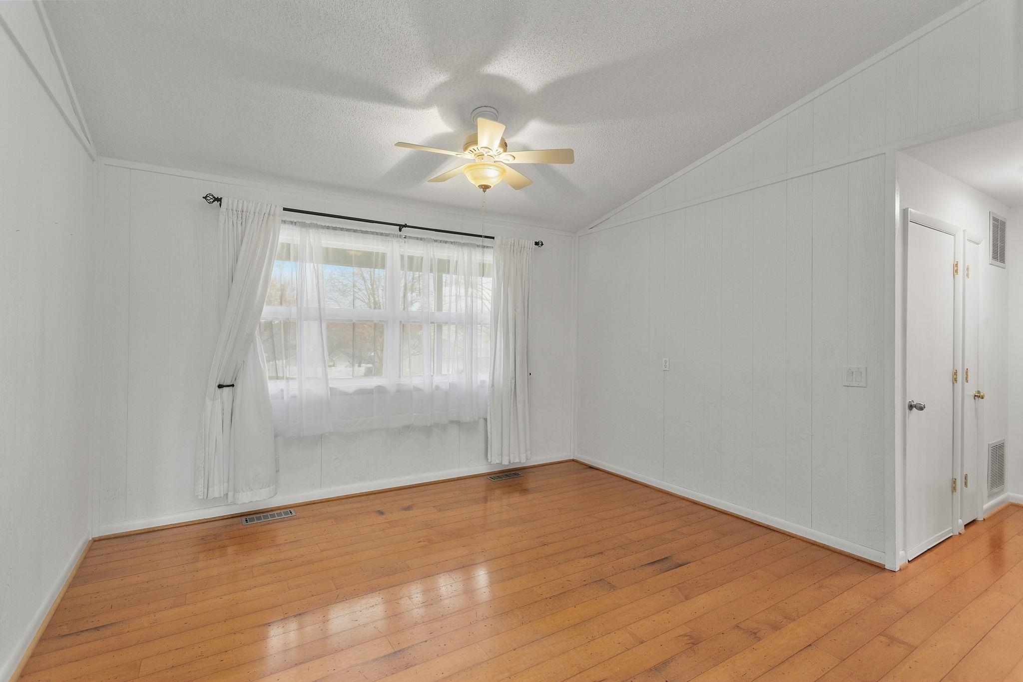 3210 Arrowhead Road Harrisonburg, VA 22801 - Photo 6 of 44 a view of empty room with wooden floor and fan