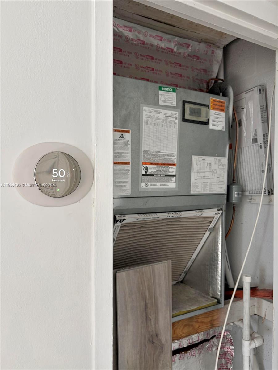 8000 Harding Avenue, Unit 5C Miami Beach, FL 33141 - Photo 12 of 13 a view of water heater room