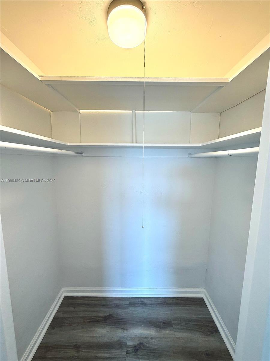 8000 Harding Avenue, Unit 5C Miami Beach, FL 33141 - Photo 6 of 13 a view of an empty walk in closet