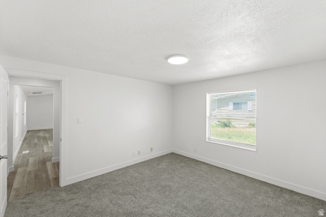 2600 North Hill Field Road, Unit 103A Layton, UT 84041 - Photo 17 of 31 Carpeted interior space featuring white walls and a single window