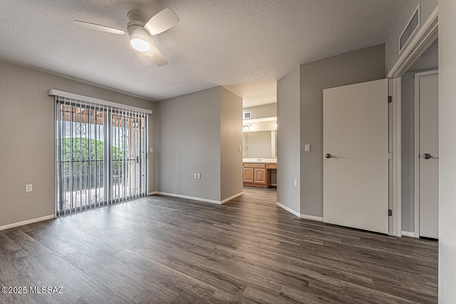 931 West Rio Guaymas Green Valley, AZ 85614 - Photo 26 of 39 wooden floor in an empty room with a window