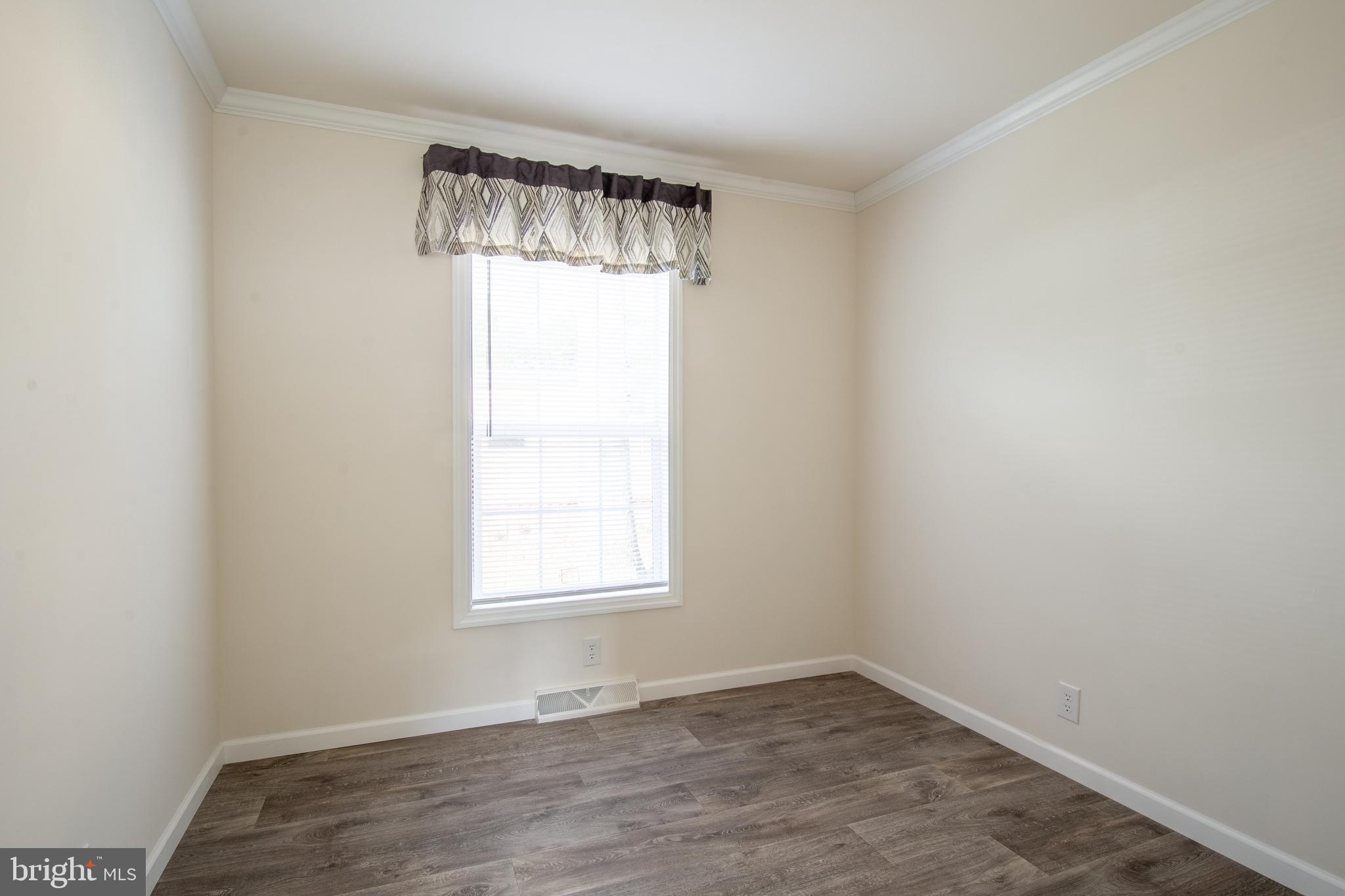 91 Longbow Lane Hartly, DE 19953 - Photo 17 of 21 an empty room with a window
