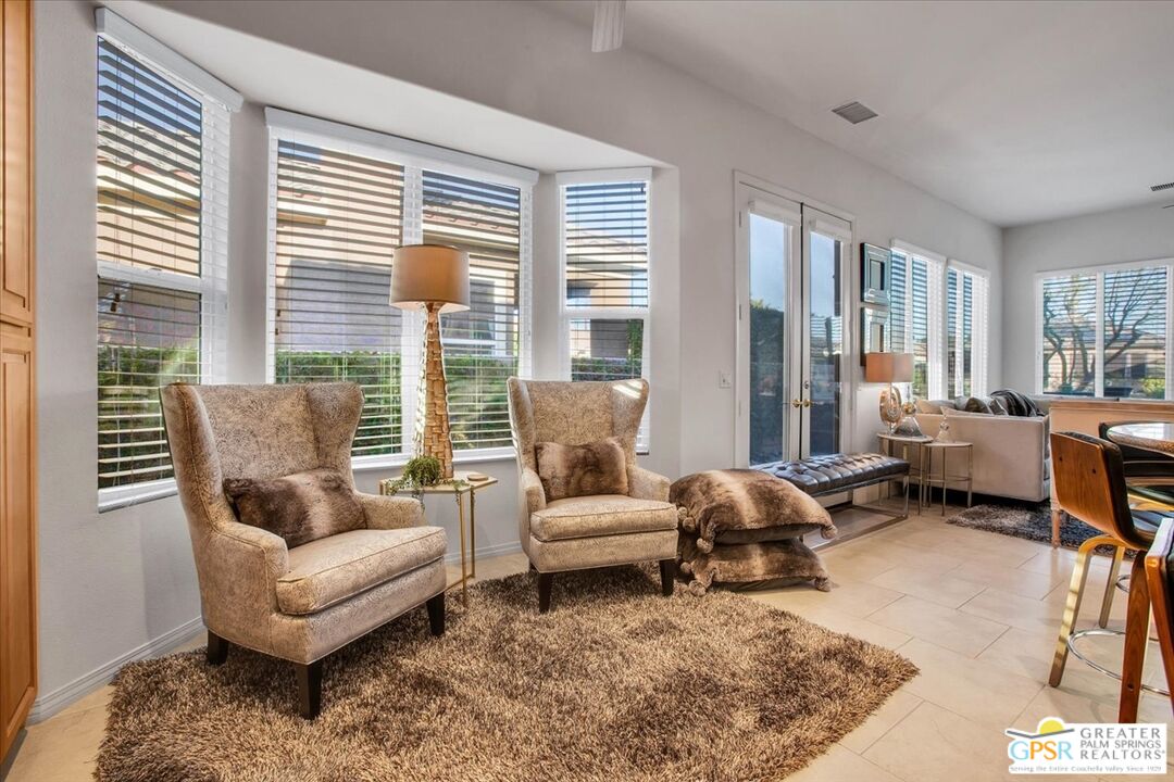 8 Lake Como Court Rancho Mirage, CA 92270 - Photo 18 of 63 a living room with furniture and a large window