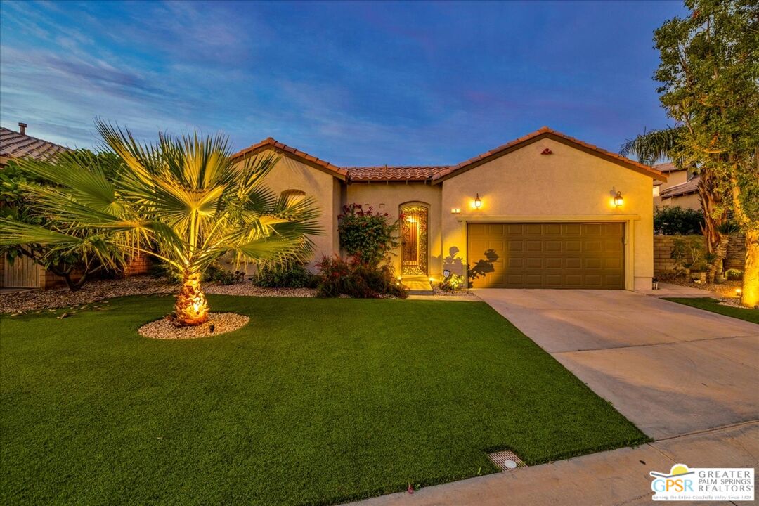 8 Lake Como Court Rancho Mirage, CA 92270 - Photo 2 of 63 a front view of a house with a garden