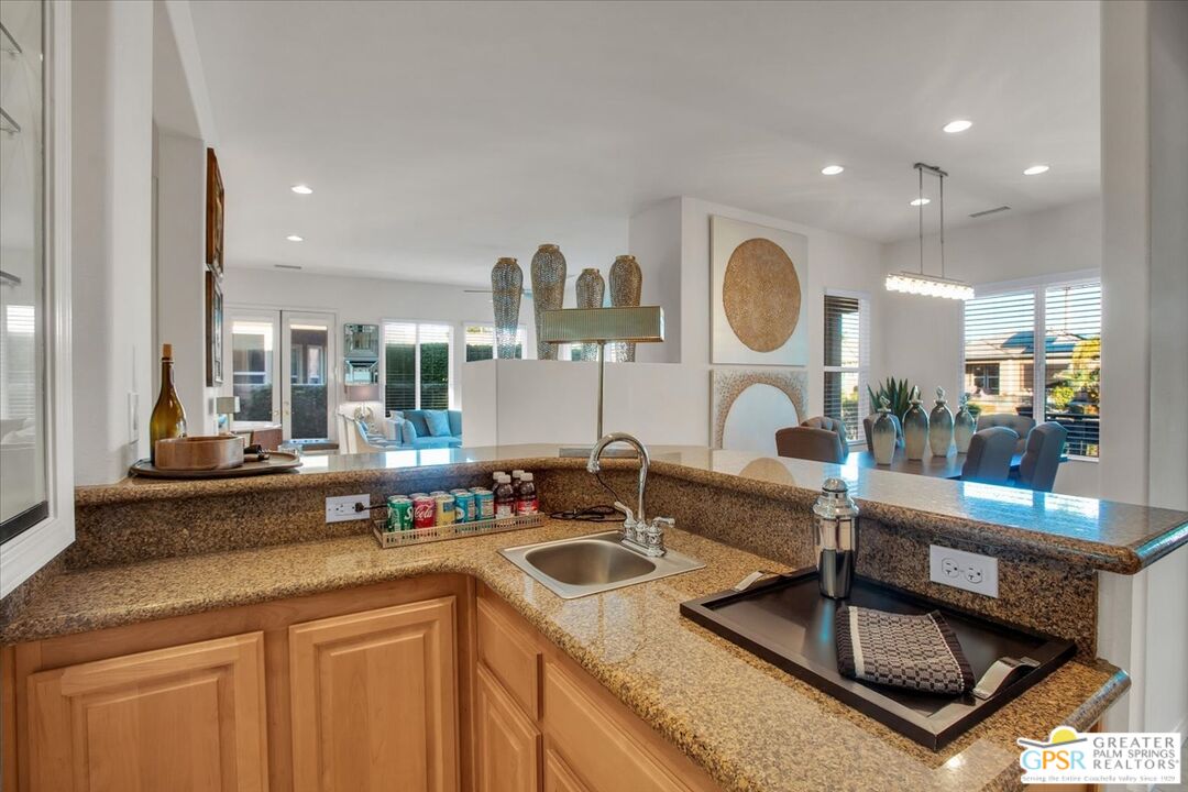8 Lake Como Court Rancho Mirage, CA 92270 - Photo 23 of 63 a kitchen with counter space a sink and cabinets