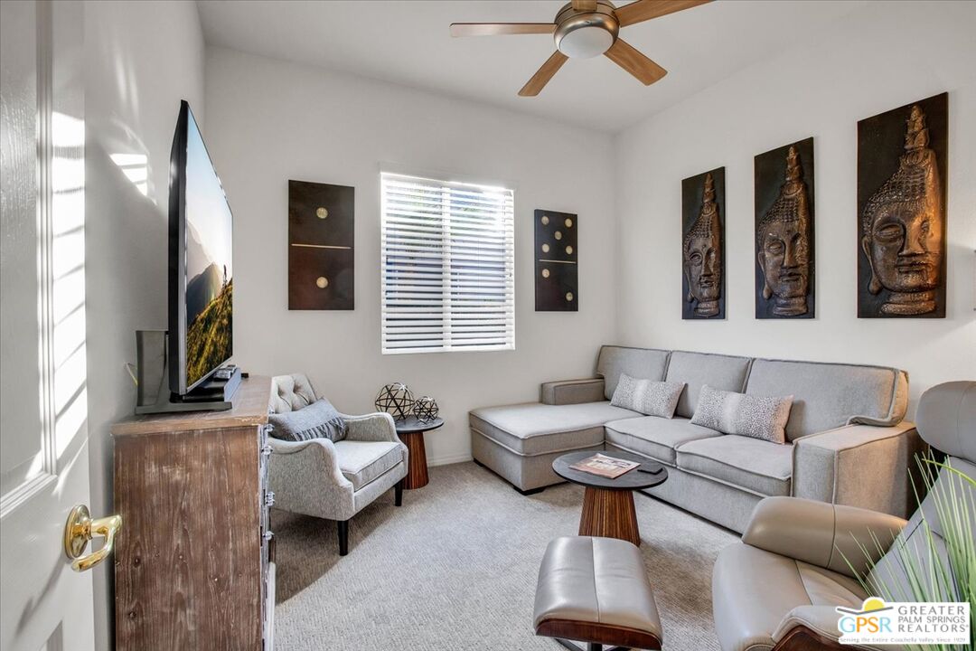 8 Lake Como Court Rancho Mirage, CA 92270 - Photo 31 of 63 a living room with furniture and a flat screen tv