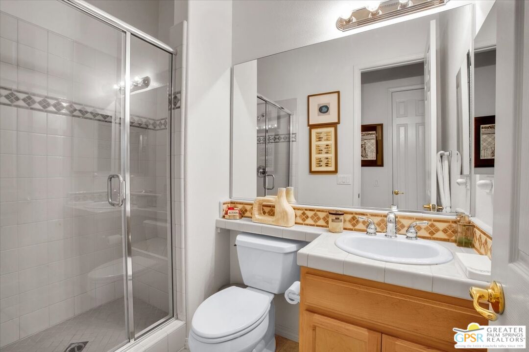 8 Lake Como Court Rancho Mirage, CA 92270 - Photo 33 of 63 a bathroom with a sink toilet and shower