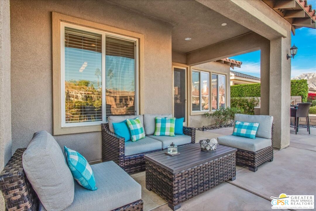 8 Lake Como Court Rancho Mirage, CA 92270 - Photo 37 of 63 a living room with furniture and a potted plant