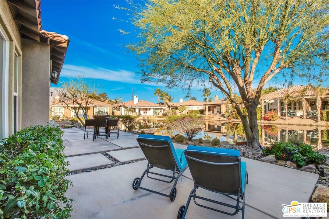 8 Lake Como Court Rancho Mirage, CA 92270 - Photo 40 of 63 a view of a patio with table and chairs and potted plants