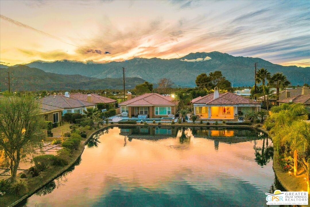 8 Lake Como Court Rancho Mirage, CA 92270 - Photo 46 of 63 a view of a lake with a houses in the back