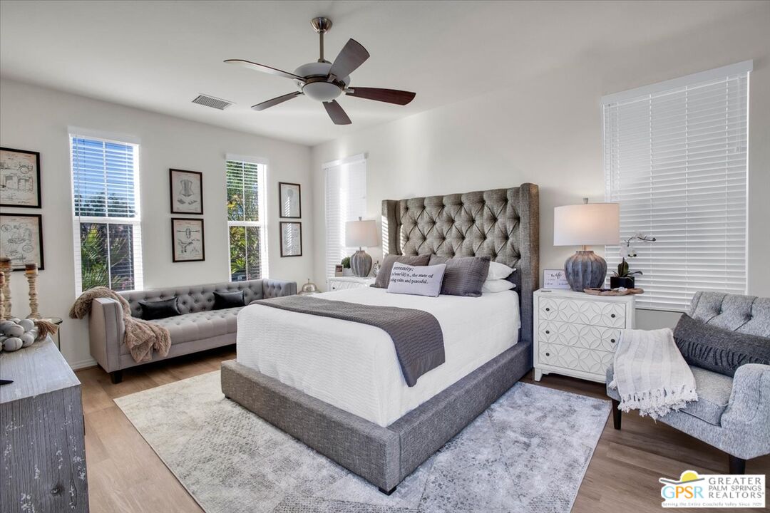 8 Lake Como Court Rancho Mirage, CA 92270 - Photo 6 of 63 a bedroom with a large bed and a couch