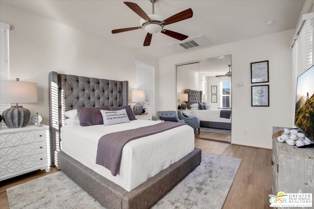 8 Lake Como Court Rancho Mirage, CA 92270 - Photo 7 of 63 a bedroom with bed and a couch